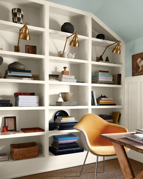 A study with built-in shelving unit painted in Swiss Coffee OC-45 and upper walls and ceiling painted in Raindance 1572.