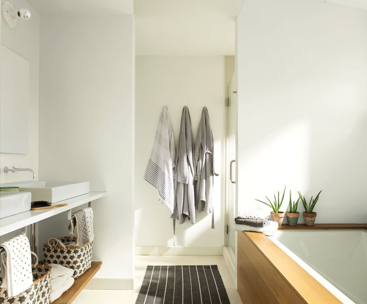 A spa-like bathroom with wooden accents.  The walls are painted in Chantilly Lace 2121-70 and woodwork painted in Dove Wing OC-18.